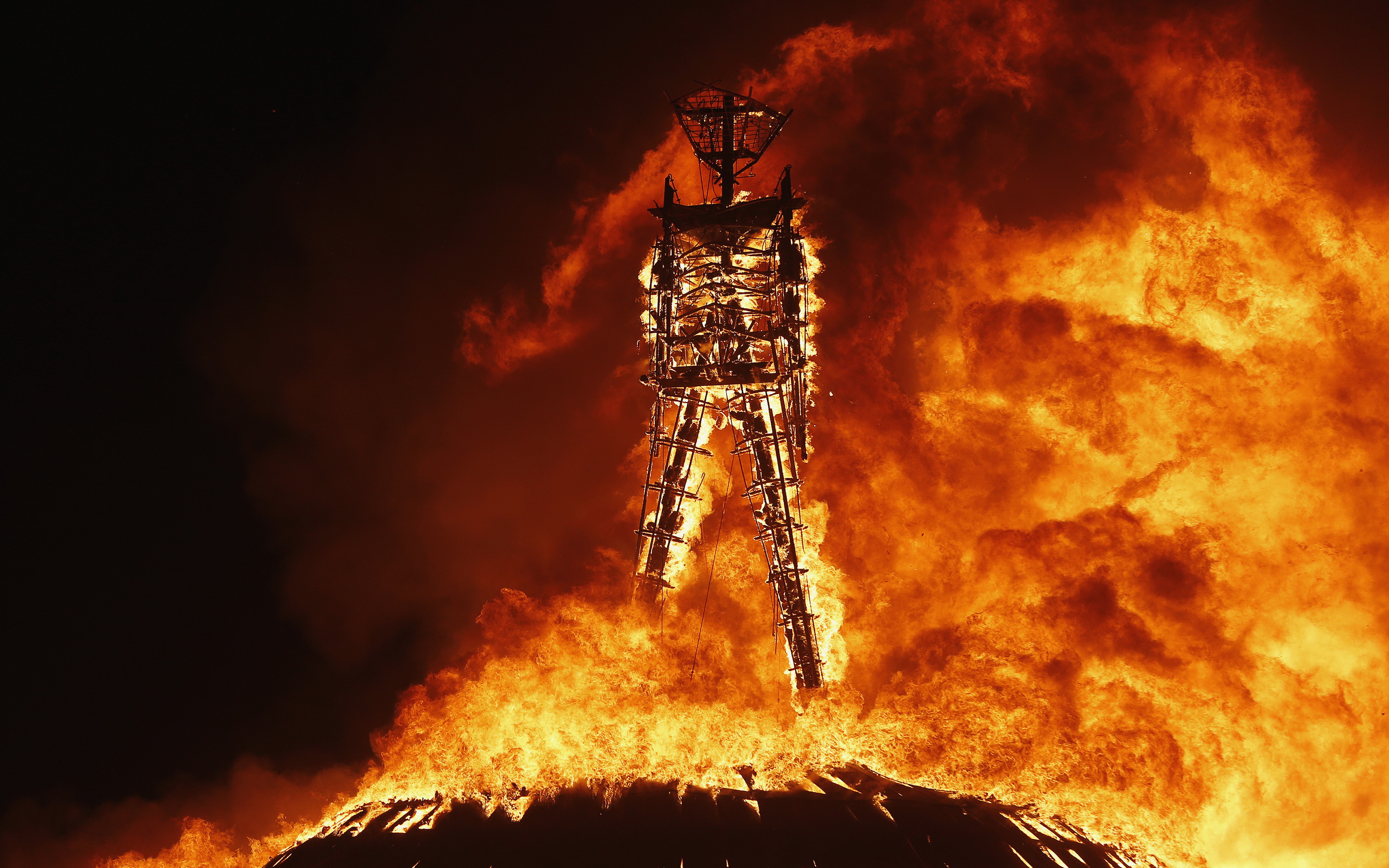 the-man-burns-during-the-burning-man-2013-arts-and-music-festival-in-the-black-rock-desert-of-nevada-august-31-2013-by-jim-urquhart.jpg