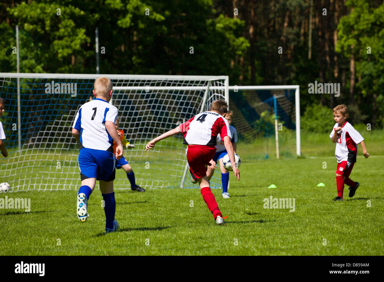 little-boys-playing-soccer-match-D859AM.jpg
