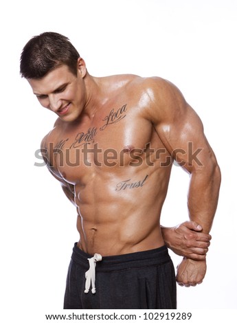 stock-photo-image-of-muscle-man-posing-in-studio-102919289.jpg