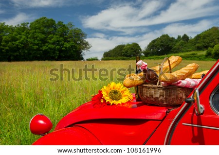 stock-photo-typical-french-car-with-bread-and-wine-for-picnic-108161996.jpg